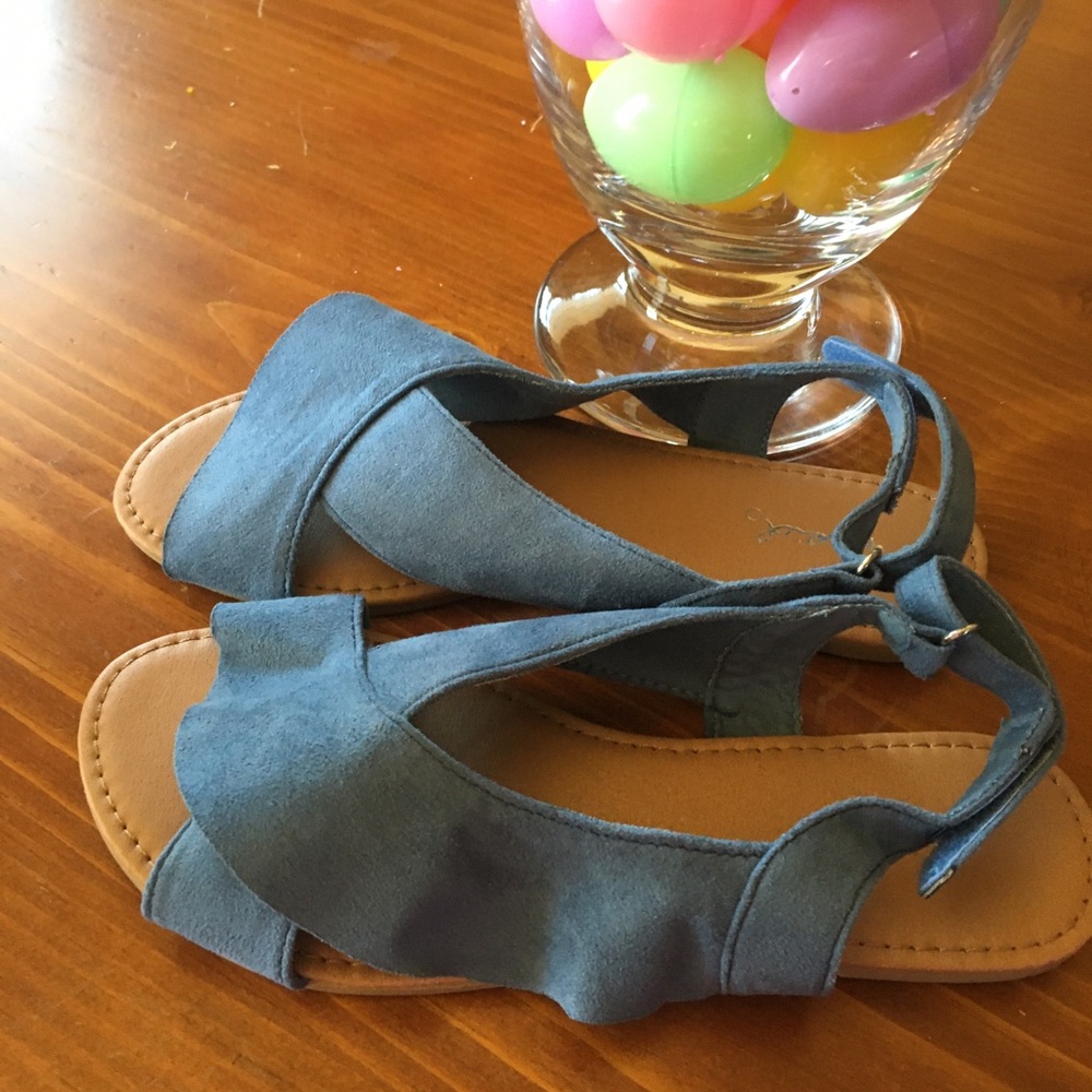 Blue lightly suede ruffle sandals.